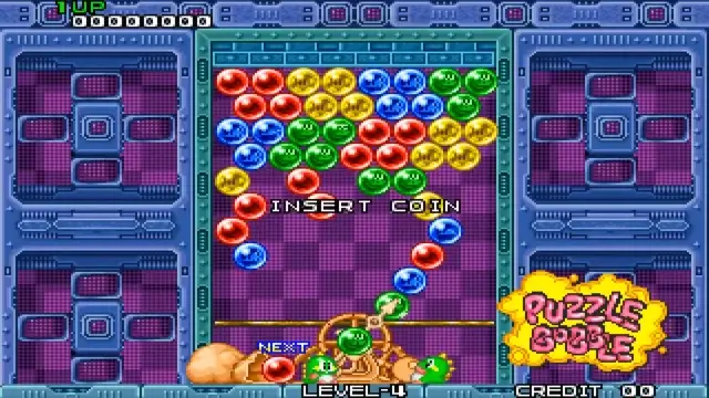 Bust-A-Move arcade gameplay with clusters of bubbles and cute chibi dinosaur mascots